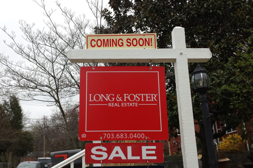 Photo shows a Long & Foster real estate sign.