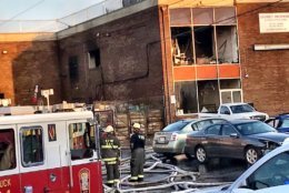 By Thursday morning, a warehouse fire that has burned for 15 hours has been reduced to "hot spots" according to D.C. Fire and EMS. (WTOP/Neal Augenstein)