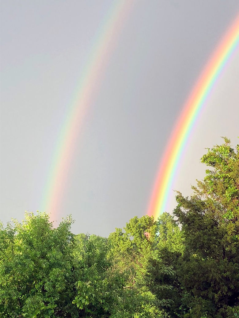 After the storms passed. a double rainbow formed. (Courtesy Erik Johnson via Twitter)