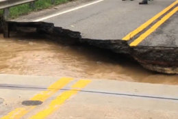 Md. 198 was a complete washout from the raging floodwaters. (WTOP/Melissa Howell)