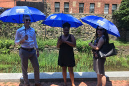 From left: Jamie Scott, Larayne Maycole and Nat Cannon, with the Georgetown Business Improvement District test out this year's parasols. This is the third year the BID has sponsored the parasol-sharing program. (Courtesy Georgetown BID)