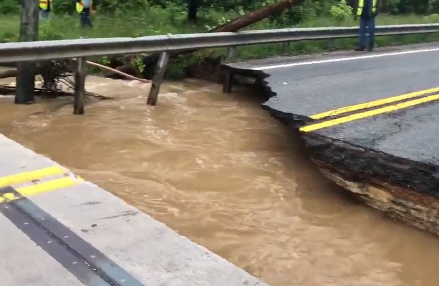 Md. 198 was a complete washout from the raging floodwaters. (WTOP/Melissa Howell)
