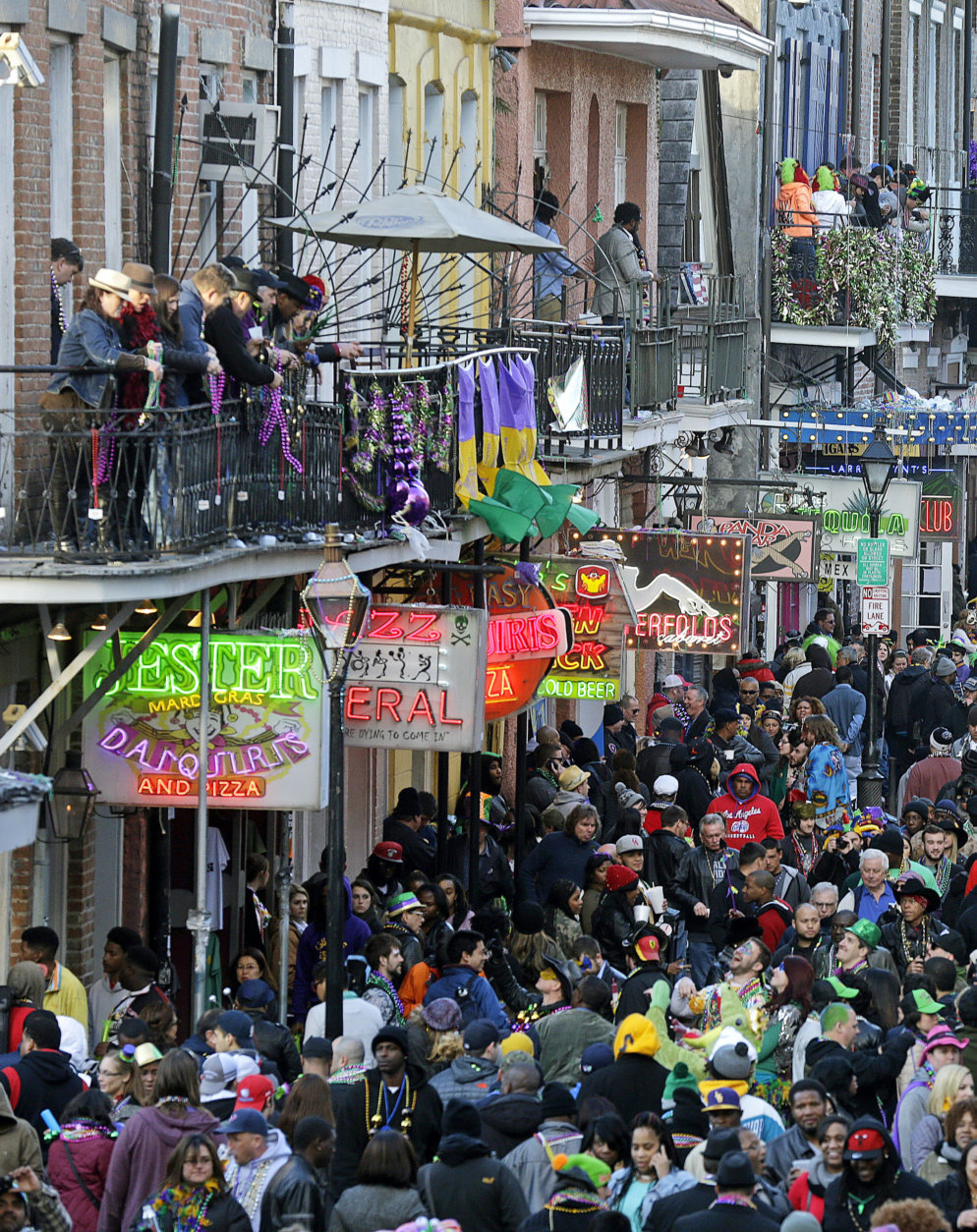FILE - In this Feb. 17, 2015 file photo, revelers pack Bourbon Street on Mardi Gras day in the French Quarter in New Orleans. Mardi Gras falls on Feb. 17, 2016, the day before is Presidents Day and the Saturday before is Valentine's Day. (AP Photo/Gerald Herbert, File)