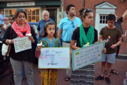 Supporters hold signs Friday night at a vigil in downtown Annapolis for victims murdered in a shooting at the Capital Gazette in Annapolis, Maryland. (Courtesy/Bethany Swain)