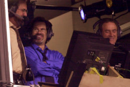 Dennis Miller, center, joins Dan Fouts, left, and Al Michaels in the ABC broadcast booth during the Monday Night Football pre-season game between the St. Louis Rams and the Tennessee Titans in Nashville, Tenn. on Monday, Aug. 14, 2000. (AP Photo/John Russell)
