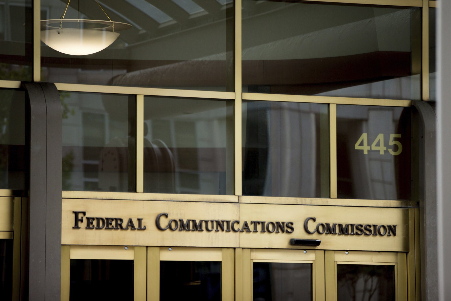 FILE - This June 19, 2015, file photo, shows the Federal Communications Commission building in Washington. On Tuesday, April 25, 2017, an appeals court upheld "net neutrality" rules that treat the internet like a public utility and prohibit blocking, slowing and creating paid fast lanes for online traffic. They have been in effect for a year. The ruling cements the FCC's authority to regulate the internet more strictly. The agency has already proposed making it harder for broadband providers to use consumer data for advertising purposes. (AP Photo/Andrew Harnik, File)
