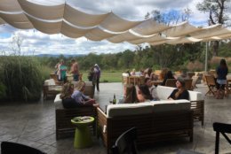 This Sept. 30, 2017 photo shows wine tasters relaxing on the patio at the James Charles Winery &amp; Vineyard in Winchester, Va. Thomas Jefferson may have been Virginia's first winemaker but it took another 200 years for the industry to blossom in the state. Today with 300 wineries, Virginia is the country's fifth-largest wine region. (AP Photo/Sally Carpenter Hale)