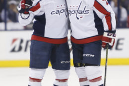 Washington Capitals' Dmitry Orlov, left, of Russia, celebrates his goal against the Columbus Blue Jackets with teammate Matt Niskanen during the first period of Game 6 of an NHL first-round hockey playoff series Monday, April 23, 2018, in Columbus, Ohio. (AP Photo/Jay LaPrete)