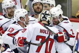 Washington Capitals goaltender Braden Holtby (70) joins the celebration of with Evgeny Kuznetsov (92), Jakub Vrana (13), Alex Ovechkin, top center, and Matt Niskanen (2) Kuznetsovs' game-winning goal during the overtime period in Game 6 of an NHL second-round hockey playoff series against the Pittsburgh Penguins in Pittsburgh, Monday, May 7, 2018. The Capitals won the game 2-1 to take the series, four games to two. AP Photo/Gene J. Puskar)