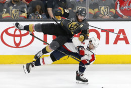 Vegas Golden Knights left wing James Neal, top, and Washington Capitals defenseman Matt Niskanen collide during the third period in Game 2 of the NHL hockey Stanley Cup Finals Wednesday, May 30, 2018, in Las Vegas. (AP Photo/Ross D. Franklin)