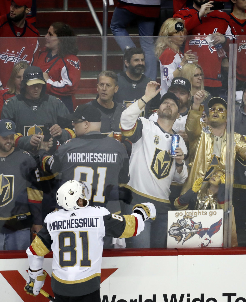 Vegas Golden Knights forward Jonathan Marchessault tosses a puck over the glass to fans as the team warms up before Game 4 of the NHL hockey Stanley Cup Final against the Washington Capitals, Monday, June 4, 2018, in Washington. (AP Photo/Pablo Martinez Monsivais)