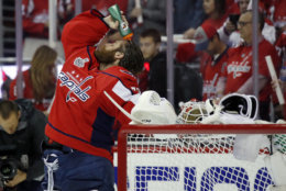 Washington Capitals goaltender Braden Holtby douses himself before Game 4 of the NHL hockey Stanley Cup Final against the Vegas Golden Knights, Monday, June 4, 2018, in Washington. (AP Photo/Alex Brandon)