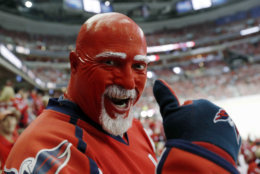 A Washington Capitals fan wears team colors during the first period in Game 4 of the NHL hockey Stanley Cup Final between the Capitals and the Vegas Golden Knights, Monday, June 4, 2018, in Washington. (AP Photo/Pablo Martinez Monsivais)