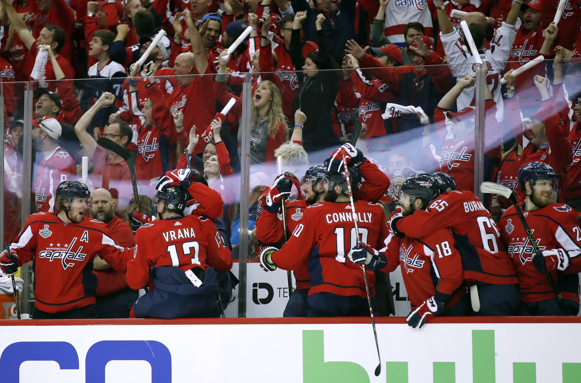 Washington Capitals players and fans celebrate one of their three goals against the Vegas Golden Knights during the first period in Game 4 of the NHL hockey Stanley Cup Final, Monday, June 4, 2018, in Washington. (AP Photo/Alex Brandon)