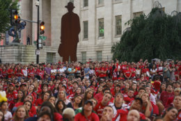 Washington Capitals fans watch Game 4 of the NHL hockey Stanley Cup Final between the Washington Capitals and the Vegas Golden Knights, Monday, June 4, 2018, outside Capital One Arena in Washington. The National Portrait Galley is in the background (AP Photo/Carolyn Kaster)