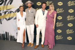 Brittney Marie Kelley, from left, Brian Kelley and Tyler Hubbard, of Florida Georgia Line, and Hayley Hubbard arrive at the CMT Music Awards at the Bridgestone Arena on Wednesday, June 6, 2018, in Nashville, Tenn. (AP Photo/Al Wagner)