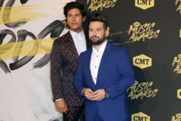 Dan Smyers, left, and Shay Mooney of musical group Dan + Shay , arrive at the CMT Music Awards at the Bridgestone Arena on Wednesday, June 6, 2018, in Nashville, Tenn. (AP Photo/Al Wagner)