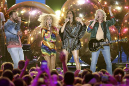 Jimi Westbrook, from left, Kimberly Schlapman, Karen Fairchild, and Phillip Sweet, of Little Big Town, perform "Summer Fever" at the CMT Music Awards at the Bridgestone Arena on Wednesday, June 6, 2018, in Nashville, Tenn. (AP Photo/Mark Humphrey)
