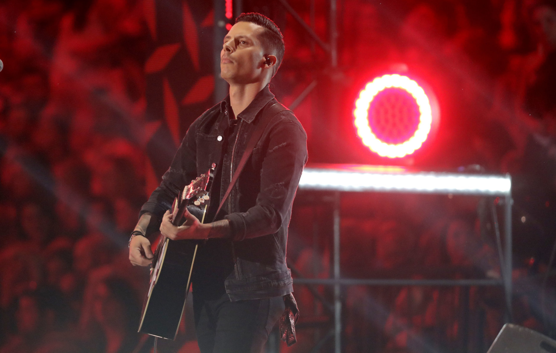 Devin Dawson performs "All On Me" at the CMT Music Awards at the Bridgestone Arena on Wednesday, June 6, 2018, in Nashville, Tenn. (AP Photo/Mark Humphrey)