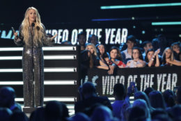 Carrie Underwood accepts the female video of the year for "The Champion" at the CMT Music Awards at the Bridgestone Arena on Wednesday, June 6, 2018, in Nashville, Tenn. (AP Photo/Mark Humphrey)