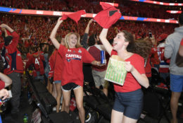 Fans at a viewing party react to a goal by Washington Capitals' Jakub Vrana during Game 5 of the NHL hockey Stanley Cup Final between the Capitals and the Vegas Golden Knights, Thursday, June 7, 2018, in Washington. (AP Photo/Nick Wass)