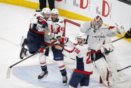 Members of the Washington Capitals celebrate as they defeat the Vegas Golden Knights in Game 5 of the NHL hockey Stanley Cup Finals to win the Stanley Cup Thursday, June 7, 2018, in Las Vegas. (AP Photo/Ross D. Franklin)