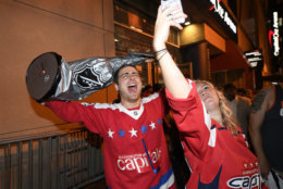 Washington Capitals fans celebrate in the streets outside Capital One Arena in Washington after Game 5 of the NHL hockey Stanley Cup Final between the Washington Capitals and the Vegas Golden Knights in Las Vegas, Thursday, June 7, 2018. The Capitals won the Stanley Cup. (AP Photo/Nick Wass)