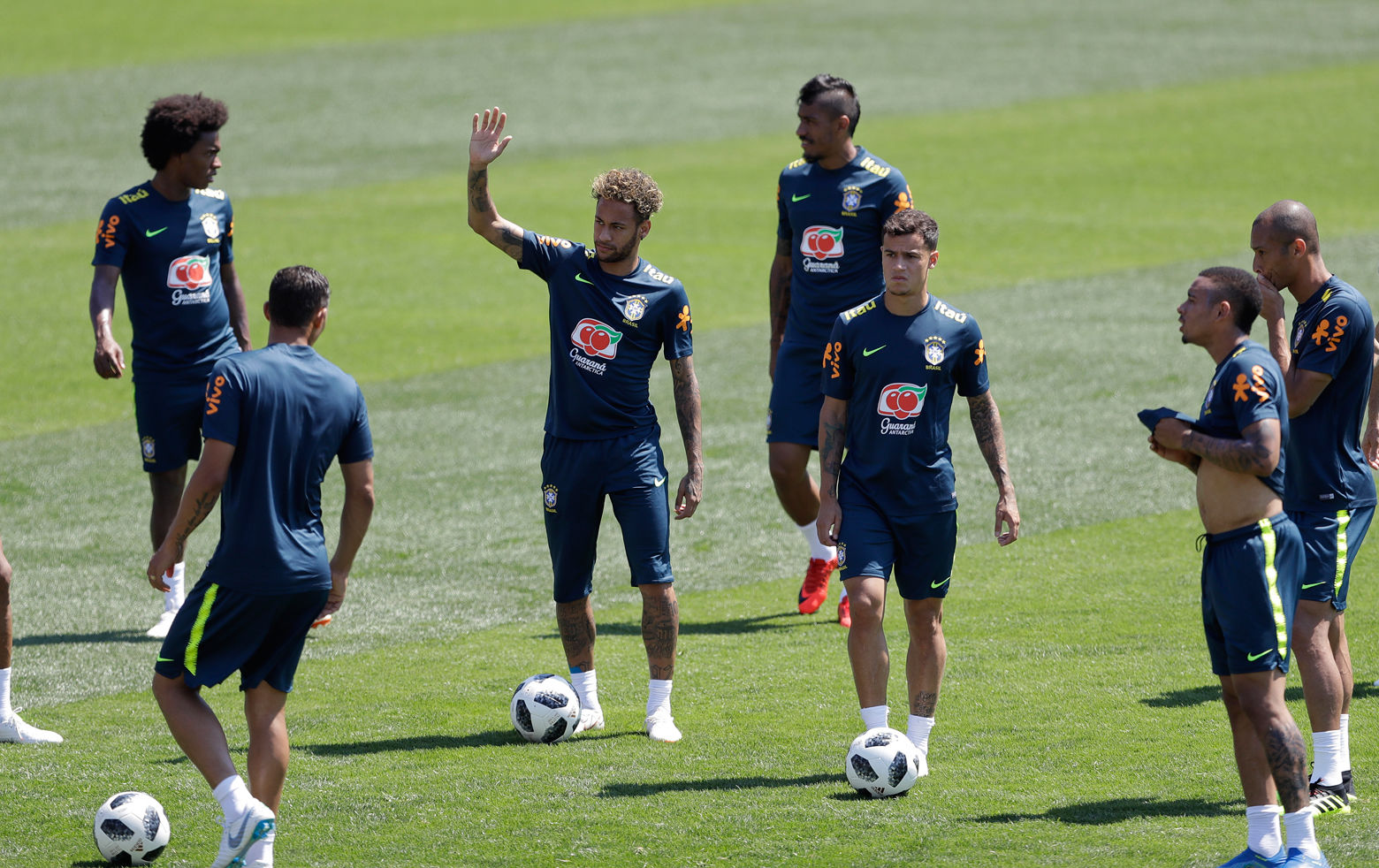 Brazil's Neymar waves to fans during a training session in Sochi, Russia, Tuesday, June 12, 2018. Brazil will face Switzerland on June 17 in the group E for the soccer World Cup. (AP Photo/Andre Penner)