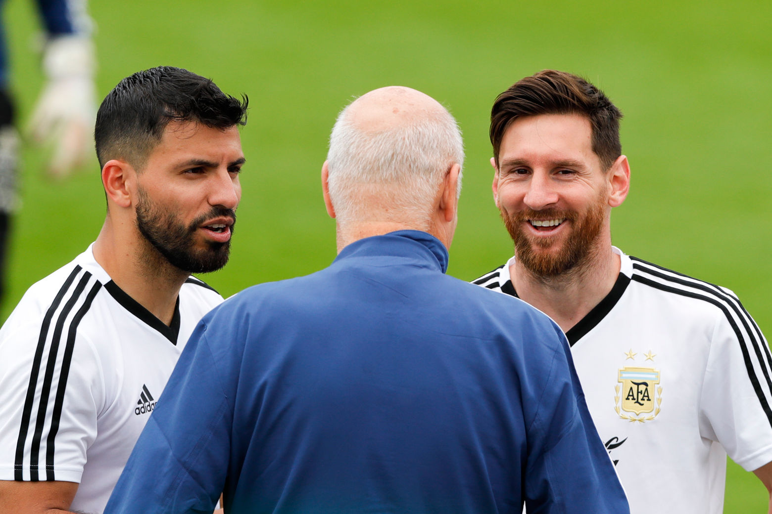 Lionel Messi, right, and Sergio Aguero talk to a team assistant during a training session of Argentina at the 2018 soccer World Cup in Bronnitsy, Russia, Wednesday, June 13, 2018. (AP Photo/Ricardo Mazalan)