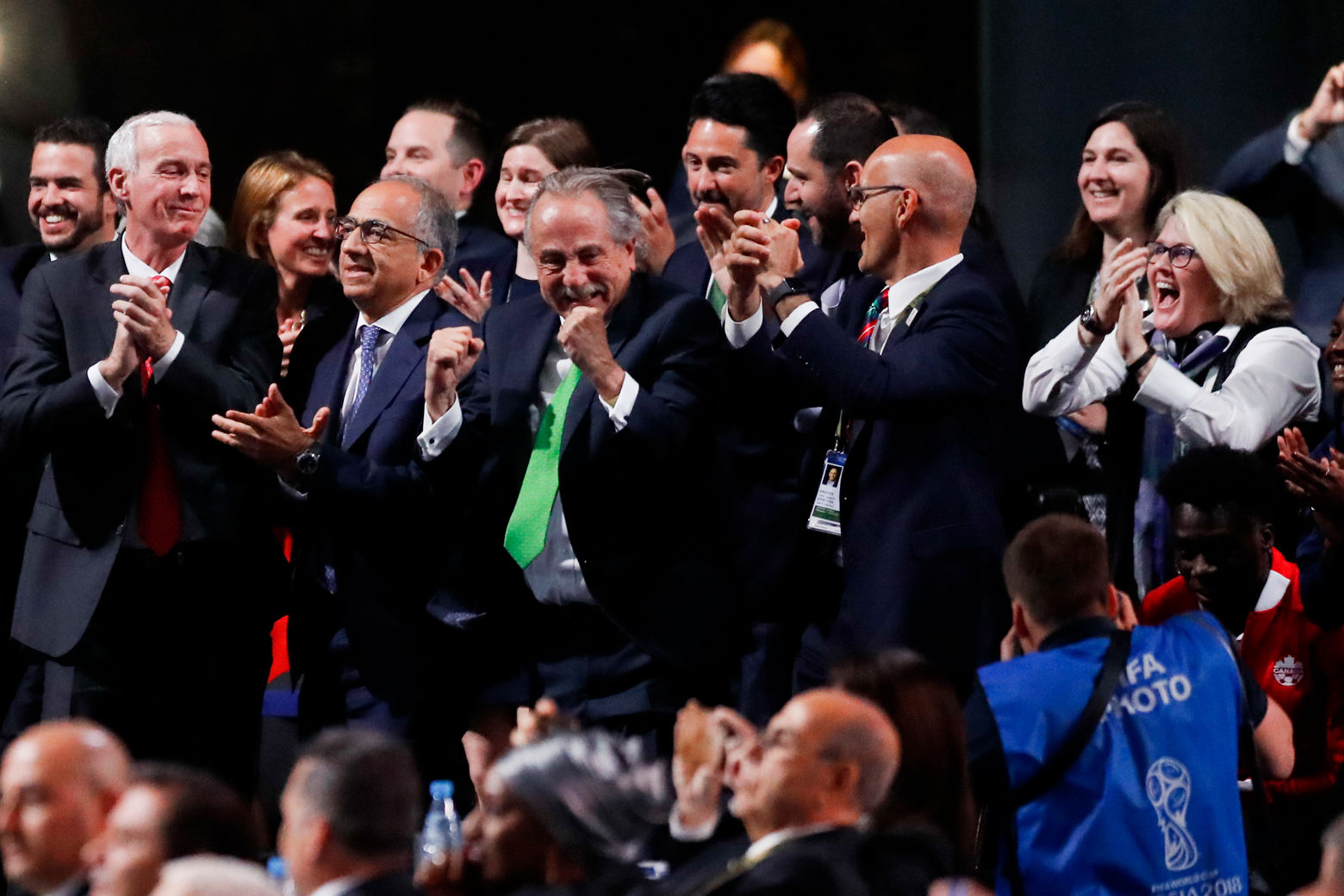 Delegates of Canada, Mexico and the United States celebrate after winning a joint bid to host the 2026 World Cup at the FIFA congress in Moscow, Russia, Wednesday, June 13, 2018. Standing on front row from left: Steve Reed, president of the Canadian Soccer Association, Carlos Cordeiro, U.S. soccer president and Decio de Maria, President of the Football Association of Mexico. (AP Photo/Pavel Golovkin)