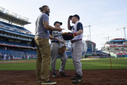 U.S. Rep. Steve Scalise, R-Louisiana, right, talks with Washington Nationals outfielder Jayson Werth, left, before the start of the 57th Congressional Baseball Game at National's Park in Washington, Thursday, June 14, 2018. On June 14, 2017, Congressional members were victims of a shooting at the baseball field they were practicing on in Alexandria, Va. (AP Photo/Cliff Owen)