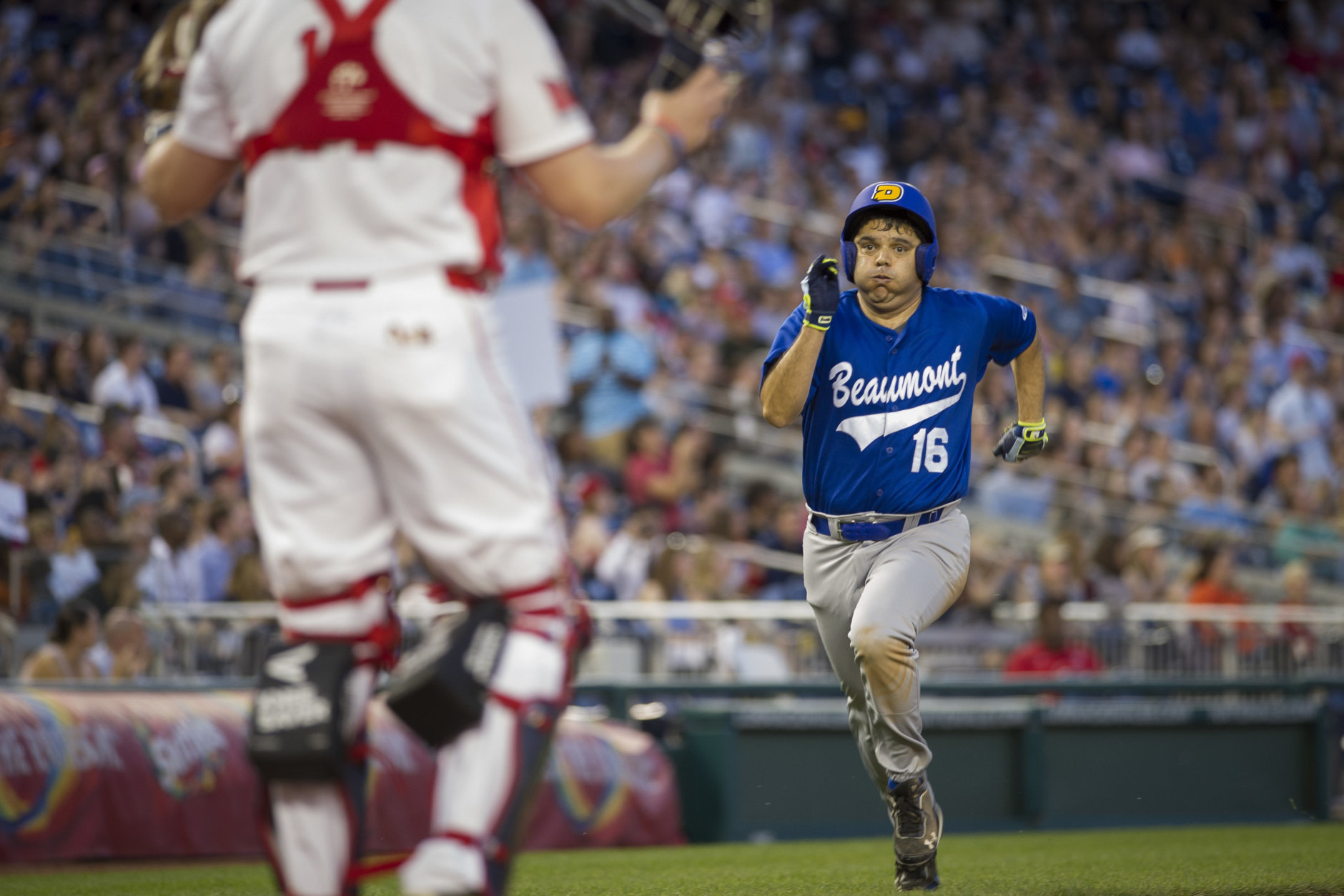 U.S. Rep. Raul Ruiz, D-California, runs for home plate after stealing home base in the fifth inning of the 57th Congressional Baseball Game at National's Park in Washington, Thursday, June 14, 2018. On June 14, 2017, Congressional members were victims of a shooting at the baseball field they were practicing on in Alexandria, Va. (AP Photo/Cliff Owen)