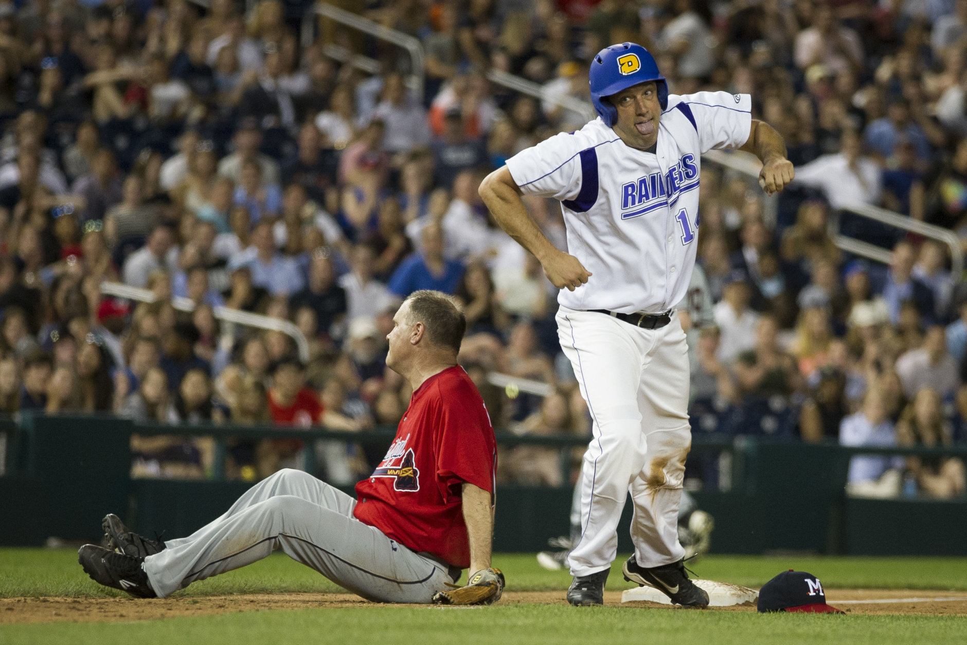 Rep. Tim Ryan, D-Ohio, right, heads for home plate after colliding with Rep. Trent Kelly, R-Miss., after Ryan stole third base during the 57th Congressional Baseball Game at National's Park in Washington, Thursday, June 14, 2018. Members of Congress played their annual baseball game Thursday night - a year after some Republican players and others were wounded in a shooting spree at a team practice in Virginia. (AP Photo/Cliff Owen)