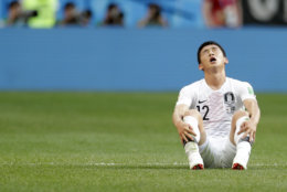 South Korea's Kim Min-woo sits on the pitch at the end of the group F match between Sweden and South Korea at the 2018 soccer World Cup in the Nizhny Novgorod stadium in Nizhny Novgorod, Russia, Monday, June 18, 2018. Sweden won 1-0. (AP Photo/Petr David Josek)