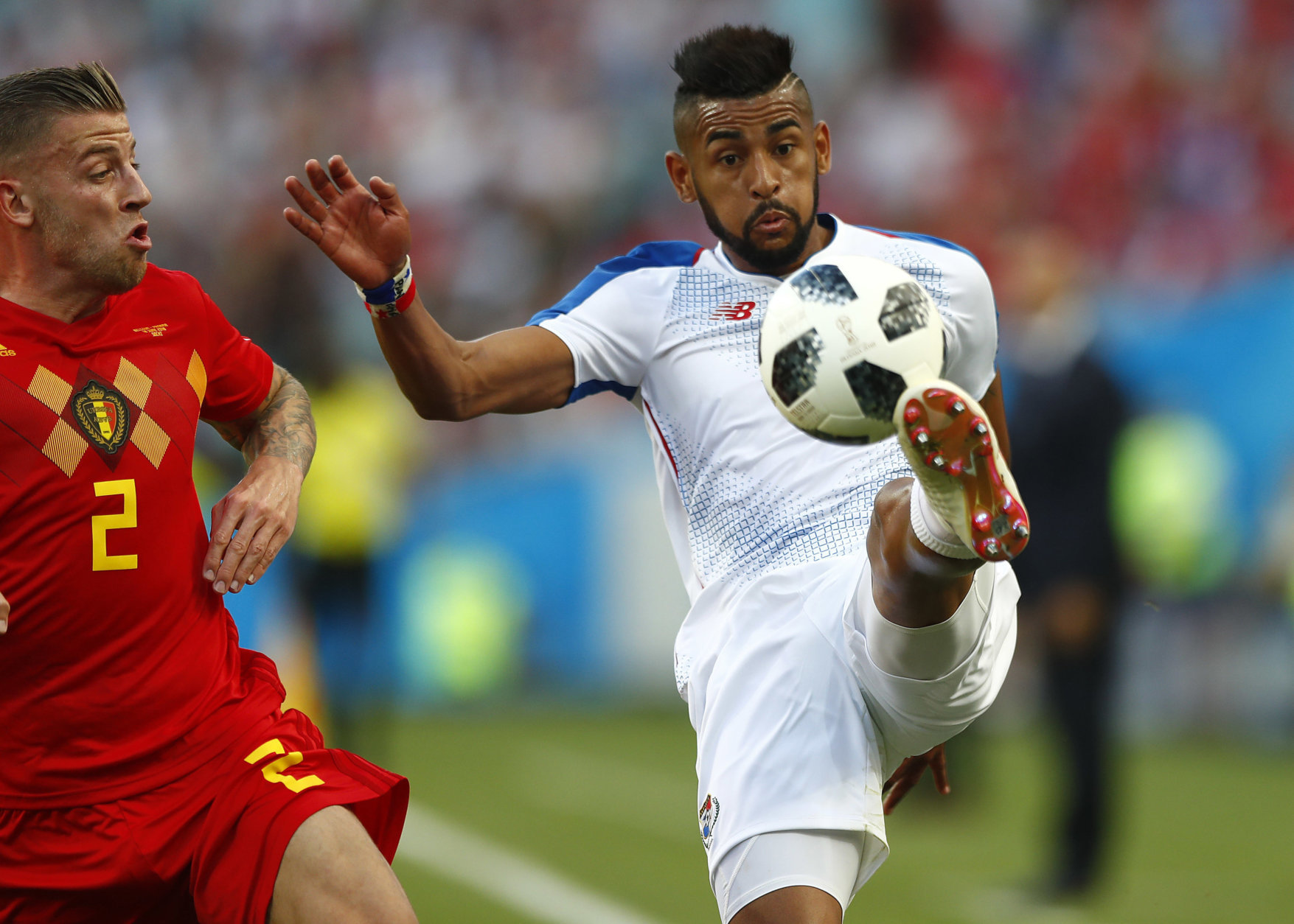 Panama's Anibal Godoy, right, and Belgium's Toby Alderweireld challenge for the ball during the group G match between Belgium and Panama at the 2018 soccer World Cup in the Fisht Stadium in Sochi, Russia, Monday, June 18, 2018. (AP Photo/Matthias Schrader)