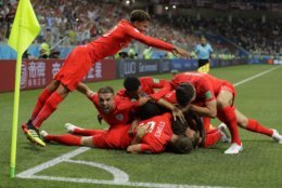 England's team celebrate after scoring their side's opening goal against Tunisia during the group G match between Tunisia and England at the 2018 soccer World Cup in the Volgograd Arena in Volgograd, Russia, Monday, June 18, 2018. (AP Photo/Sergei Grits)