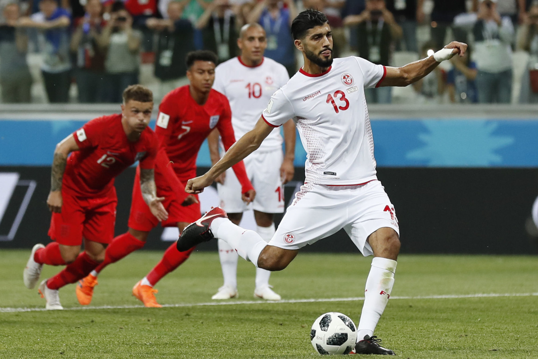 Tunisia's Ferjani Sassi scores from the penalty spot during the group G match against England at the 2018 soccer World Cup in the Volgograd Arena in Volgograd, Russia, Monday, June 18, 2018. (AP Photo/Alastair Grant)