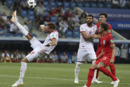 Tunisia's Fakhreddine Ben Youssef, left, kicks the ball during the group G match between Tunisia and England at the 2018 soccer World Cup in the Volgograd Arena in Volgograd, Russia, Monday, June 18, 2018. (AP Photo/Thanassis Stavrakis)