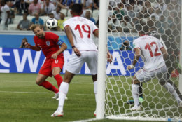 England's Harry Kane scores his side's 2nd goal against Tunisia during a group G match at the 2018 soccer World Cup in the Volgograd Arena in Volgograd, Russia, Monday, June 18, 2018. (AP Photo/Alastair Grant)