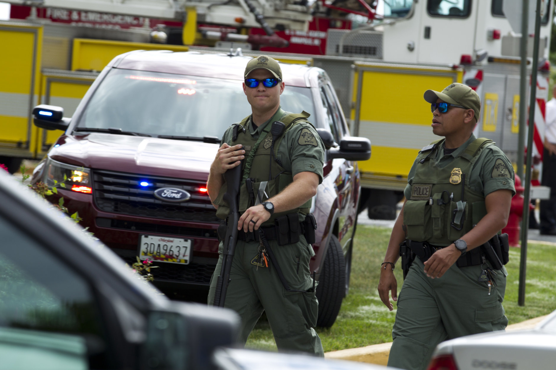 Maryland police officers patrol the area after multiple people were shot at at The Capital Gazette newspaper in Annapolis, Md., Thursday, June 28, 2018. (AP Photo/Jose Luis Magana)