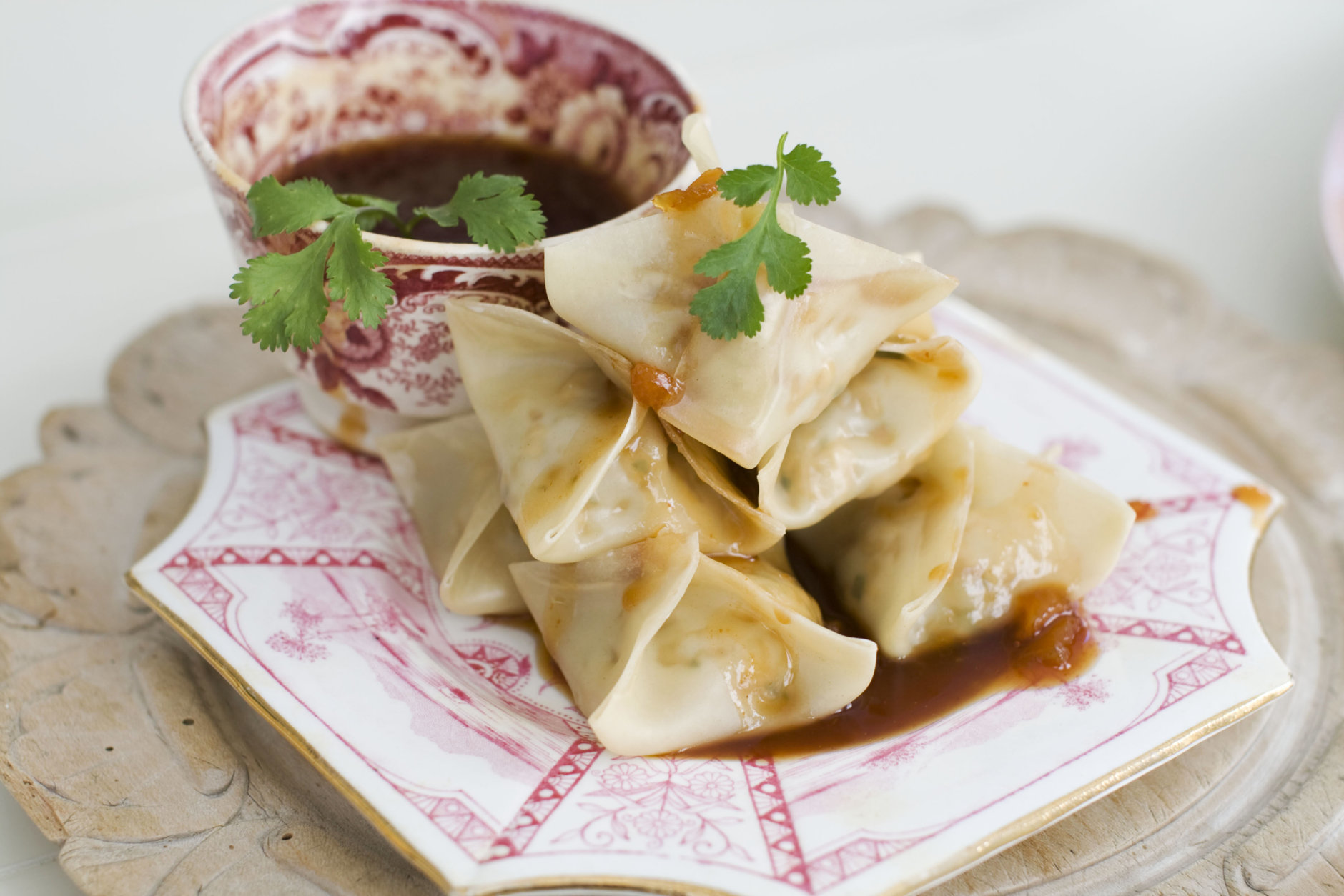 In this image taken on January 14, 2013, vegetarian steamed dumplings with sweet-and-sour sauce are shown served on a plate in Concord, N.H. (AP Photo/Matthew Mead)
