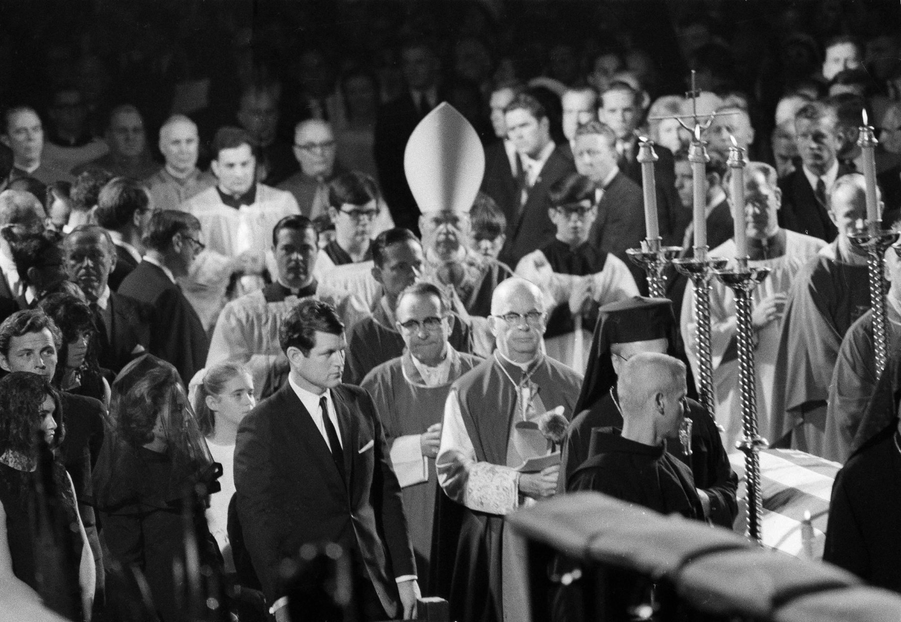 Sen. Edward Kennedy enters St. Patrick's Cathedral for the funeral for his brother Robert F. Kennedy, June 8, 1968.  Behind him is Robert Kennedy's widow, Ethel Skakel Kennedy. New York Roman Catholic Archbishop Terence Cooke is seen at center. New York City Mayor John V. Lindsay is seen at far right  (AP Photo)