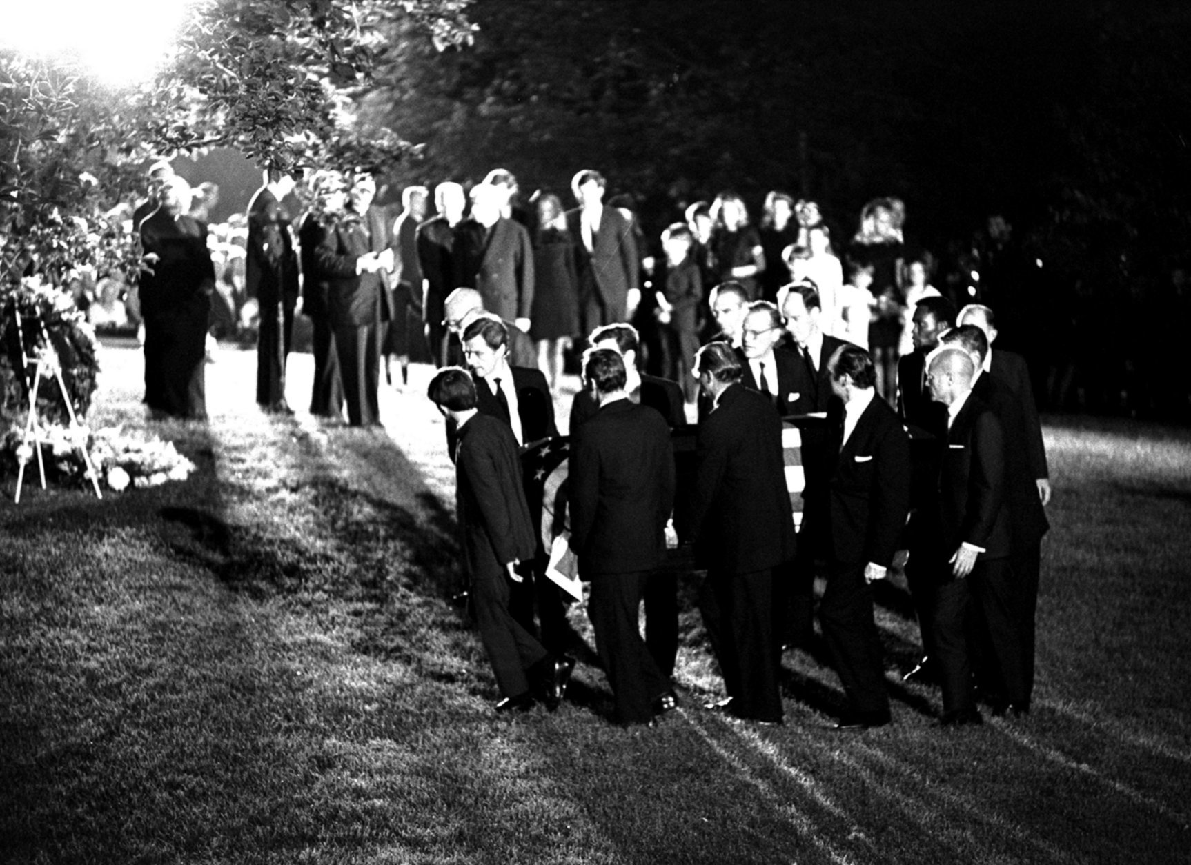The casket of Robert F. Kennedy is carried to the gravesite at Arlington National Cemetery, June 8, 1968.  The pallbearers are led by Kennedy's oldest son, Joseph. (AP Photo)