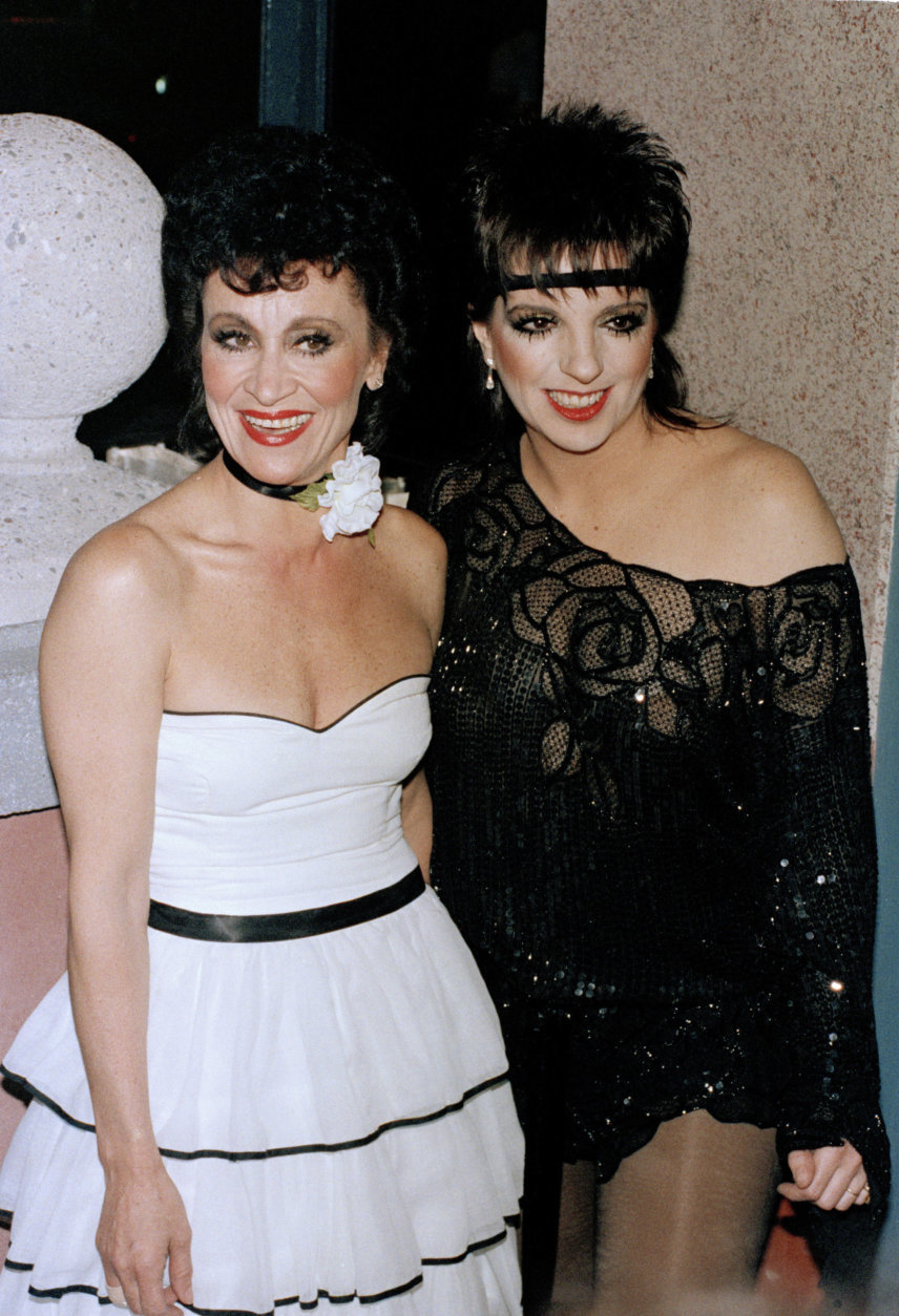 Entertainer Liza Minnelli, right, and actress Chita Rivera are shown during a party Minnelli hosted to honor Rivera's winning the best actress Tony for "The Rink," June 9, 1984, in New York. (AP Photo)