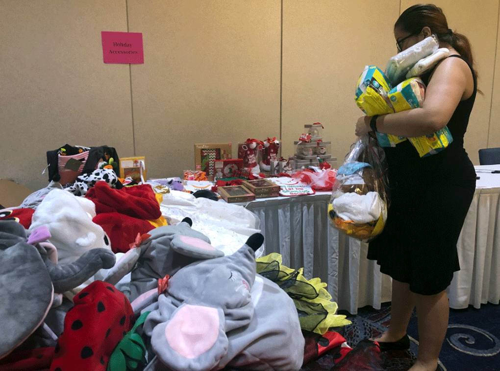 Expecting moms receive gifts at Operation Homefront's special baby shower on June 16, 2018. (WTOP/Melissa Howell)
