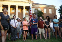 People gather for a vigil in response to a shooting at the Capital Gazette newsroom, Friday, June 29, 2018, in front of the Maryland State House in Annapolis, Md. Prosecutors say Jarrod W. Ramos opened fire Thursday in the newsroom. (AP Photo/Patrick Semansky)