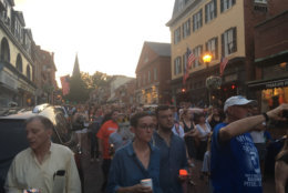 Mourners walk during a vigil after the shooting at the Capital Gazette. (WTOP/Mike Murillo)