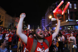 Brian "Buzz" Ganow, 22, of Manassas, Va., celebrates a goal in the second period of Game 3 of the NHL hockey Stanley Cup Final between the Washington Capitals and the Vegas Golden Knights, Saturday, June 2, 2018, in Washington. Fans could watch the game on a large screen outside the venue. "I've lived here my whole life," says Ganow, "so I've been waiting for this for a long time." (AP Photo/Jacquelyn Martin)