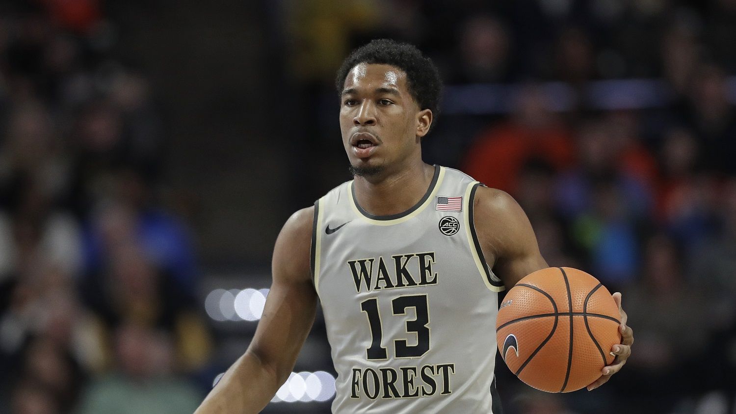 Wake Forest's Bryant Crawford (13) brings the ball up the court against Clemson during the first half of an NCAA college basketball game in Winston-Salem, N.C., Saturday, Feb. 3, 2018. (AP Photo/Chuck Burton)