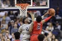 Georgetown forward Marcus Derrickson (24) blocks St. John's guard Shamorie Ponds (2) during the first overtime of an NCAA college basketball game, Saturday, Jan. 20, 2018, in Washington. Georgetown won 93-89 in double overtime. (AP Photo/Nick Wass)